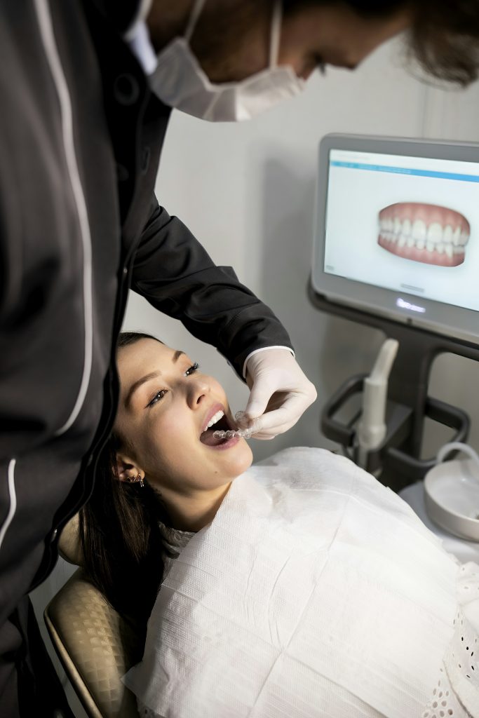 Dentist examining a patient with a digital dental scanner